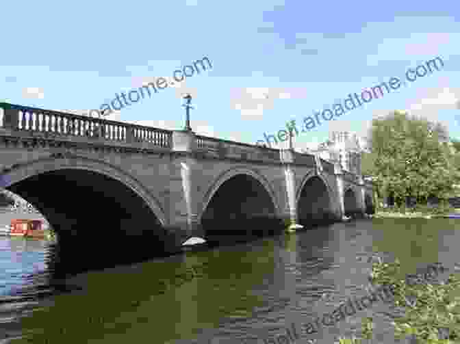 A Historic Stone Bridge Spanning The River Thames, With Boats Passing Underneath. The Historic Thames Hilaire Belloc