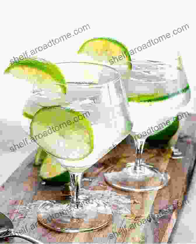 A Refreshing Gin And Tonic Garnished With A Lime Wedge Hello 365 Cocktail Recipes: Best Cocktail Cookbook Ever For Beginners Gin Cookbook Rum Recipes Bourbon Cookbook Martini Recipes Tequila Recipes Mojito Recipe Margarita Recipes 1