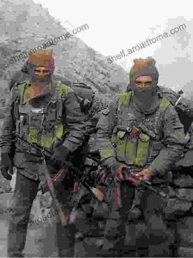 A Soviet Soldier Cautiously Navigating A Treacherous Mountain Pass In Afghanistan AFGHANISTAN THE SPY WAR OF SOVIET UNION